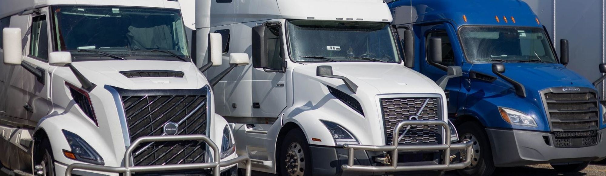 semi trucks driving on highway